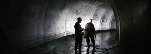 MWMO monitoring team members in a Minneapolis stormtunnel