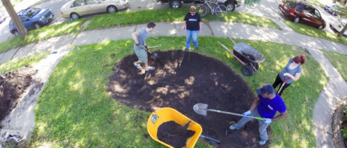 volunteers building a raingarden