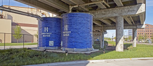 A pair of painted blue cisterns