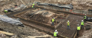 Workers prepare to pour the foundation for the main treatment chamber.