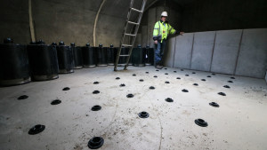 A worker stands in the StormFilter chamber of the St. Anthony Regional Stormwater Treatment and Research System.