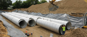 Workers installing underground storage tanks.