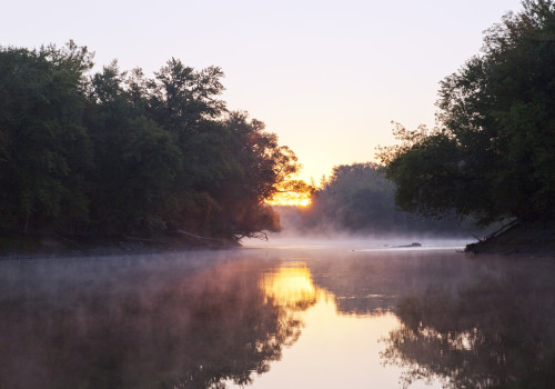 A misty river scene.