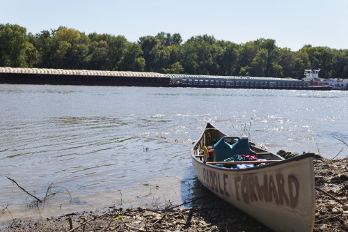 A canoe on the shore of the Mississippi River.