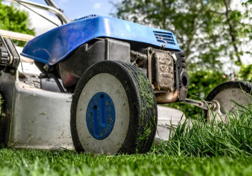 Close-up of a lawn mower cutting grass.