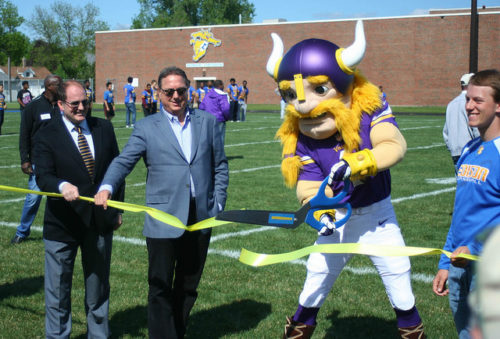 A ribbon-cutting event for the new athletic field at Edison High School.