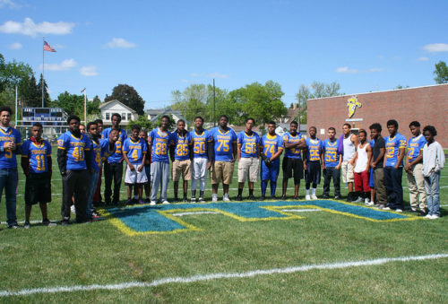 Edison High School athletes posing for a photo on the athletic field.