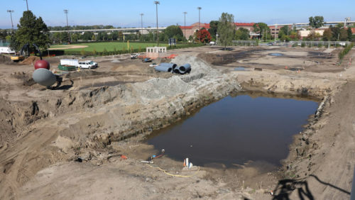 Sept. 30, 2016: The excavated storage tank location, filled with water and waiting to be drained.
