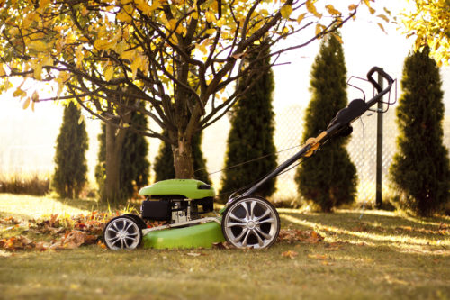 A lawn mower mulching leaves.