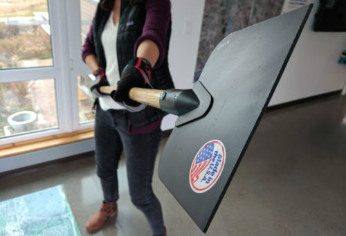 woman holding ice chisel