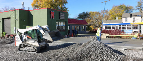 Workers from Nelco Landscaping laying the base aggregate and finishing the concrete pad on Nov. 1, 2016.