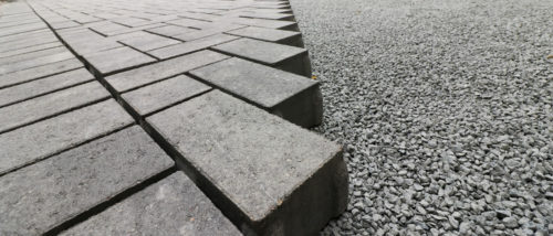 A closeup of the custom pavers and the aggregate base during construction.