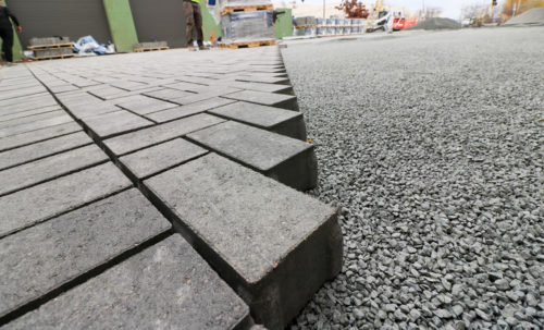 A partially installed permeable paver parking lot.