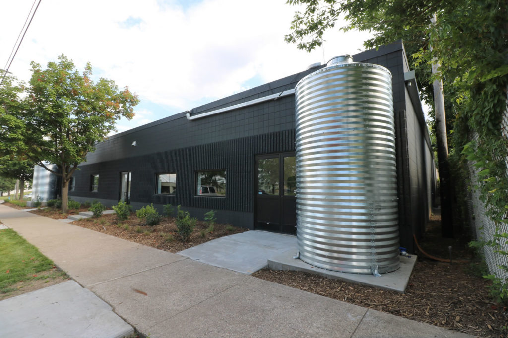 A pair of 1,500-gallon cisterns capture runoff from the roof.