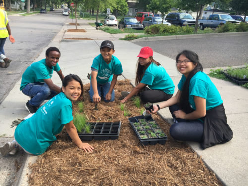 MRGT members planting a boulevard raingarden.