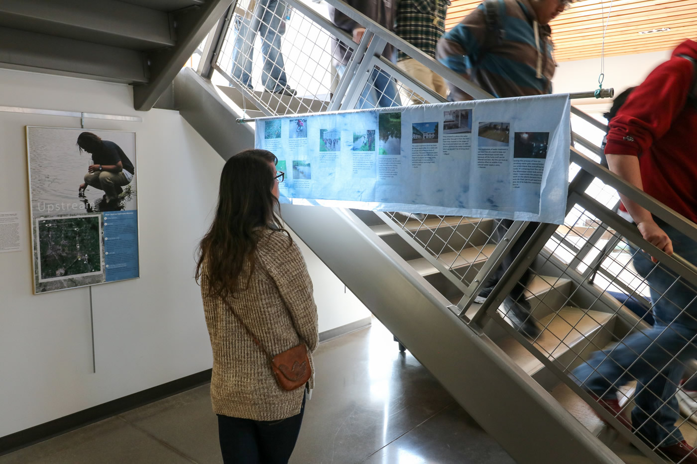 A student observing an exhibit piece.