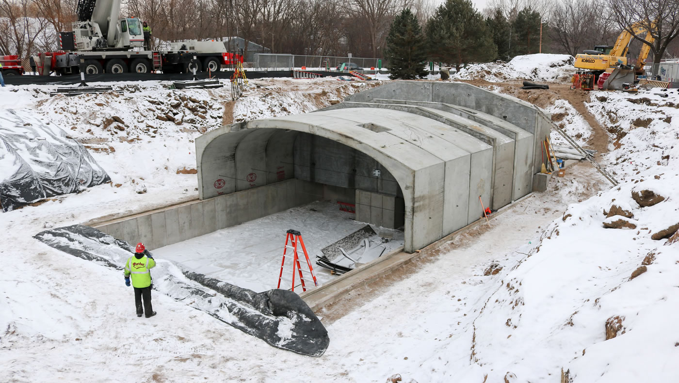 A worker stands next to the partially constructed St. Anthony Regional Stormwater Treatment and Research System in January 2016.