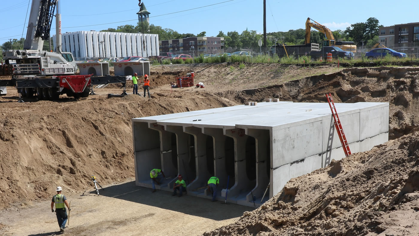 Workers assemble the precast concrete sections of the Towerside District Stormwater System's storage tank.