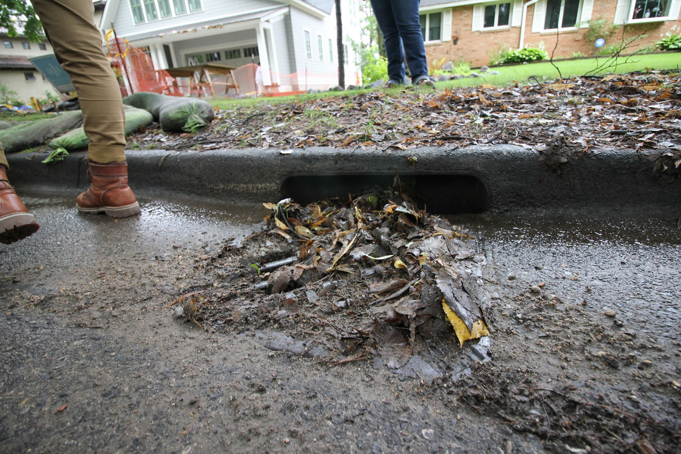 A stormdrain clogged with leaves and sediment at a construction site in Minneapolis.