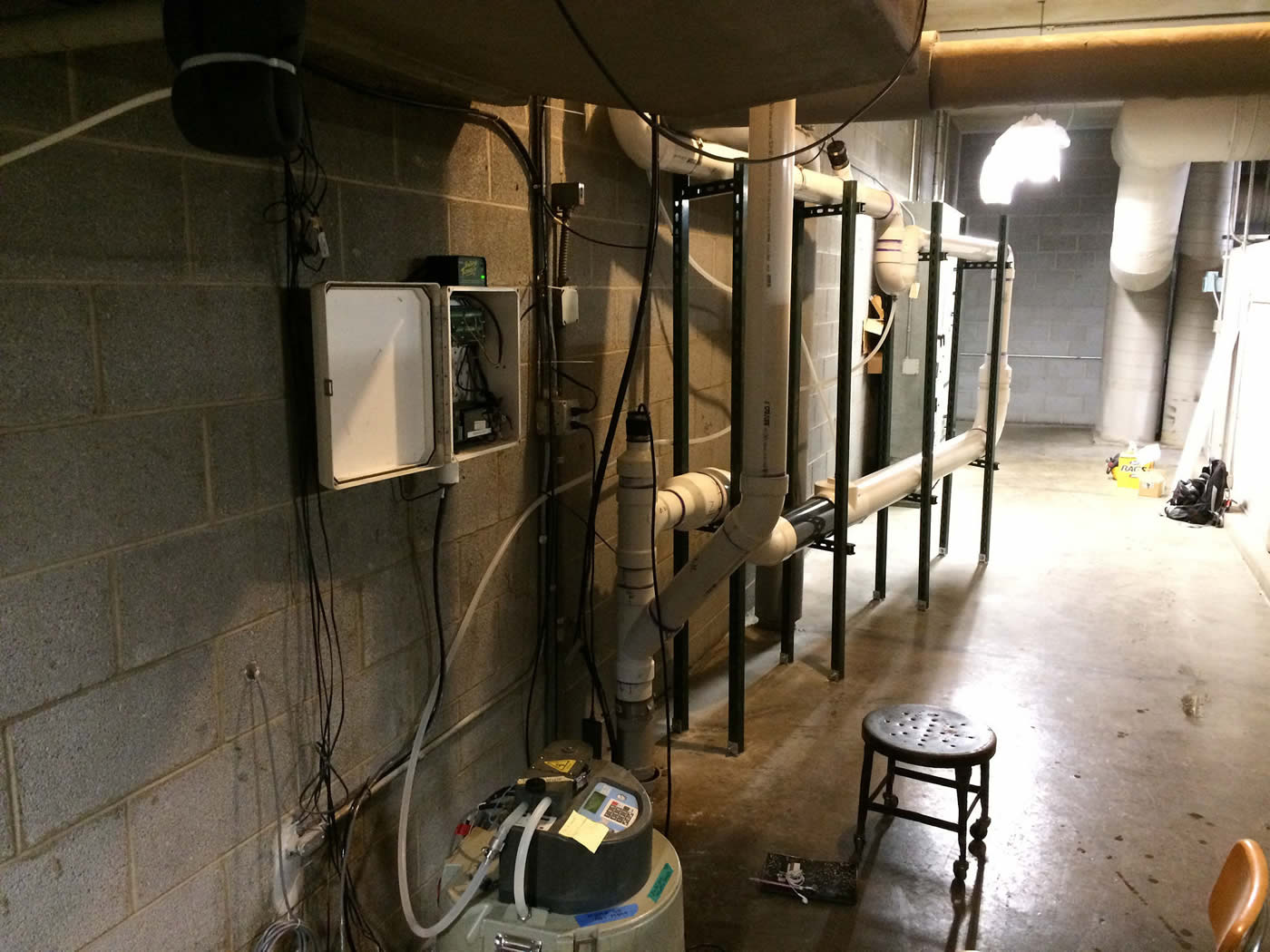 Pipes and automated sampling equipment inside a building.