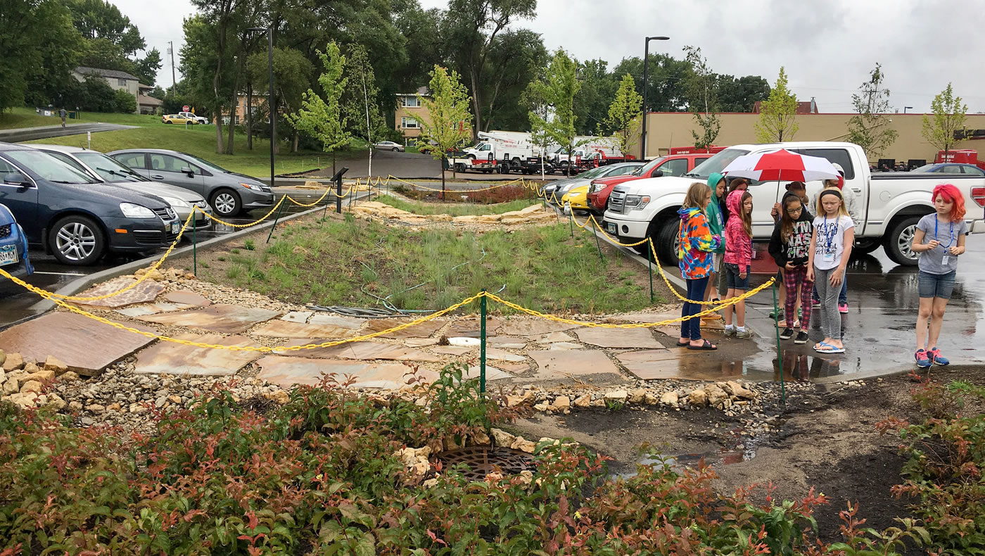 Camp participants touring the stormwater treatment features at the Columbia Heights Library.