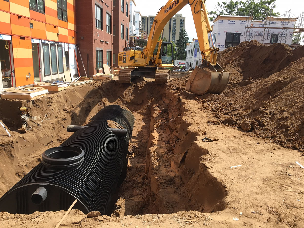 A stormwater storage tank being installed at EcoVillage Apartments.