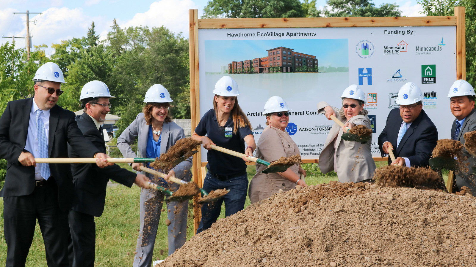 Project partners at the groundbreaking ceremony for EcoVillage Apartments, which was completed in 2017.