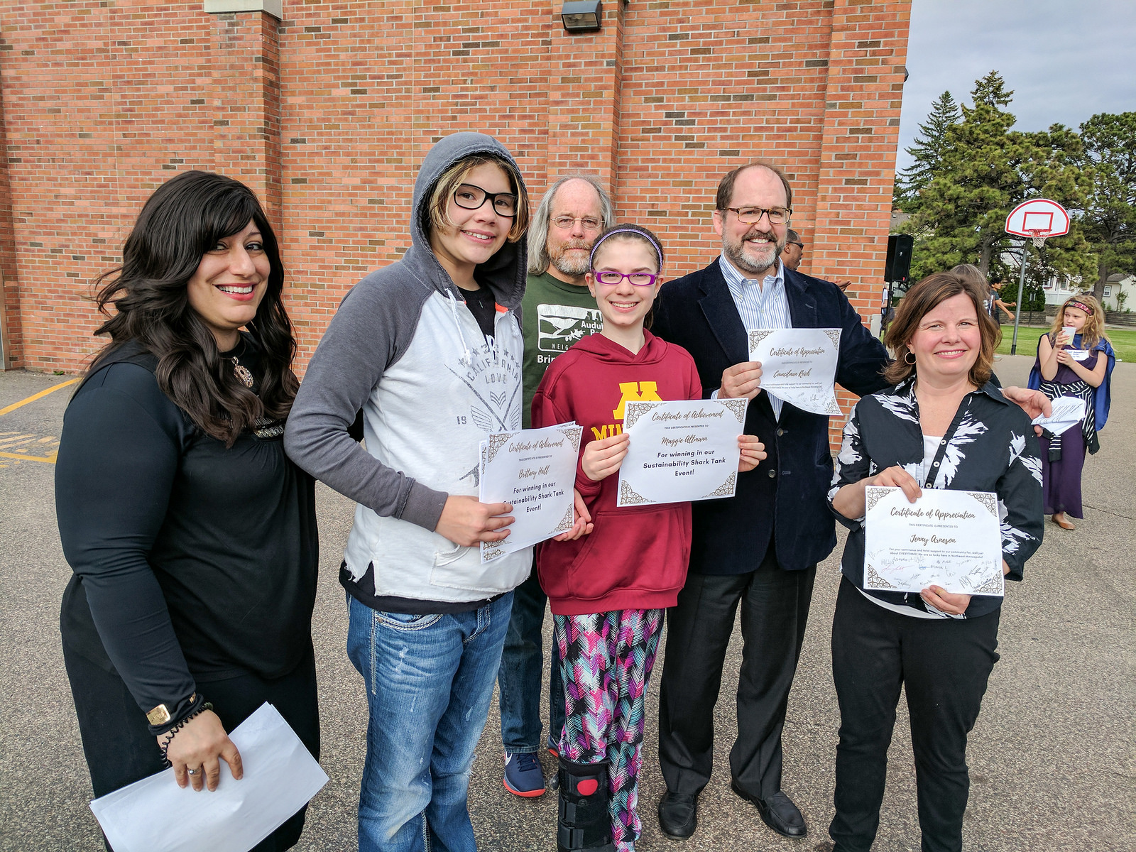 From left: Northeast Middle School Science Teacher Yosefa Carriger, student Brittany Hall, Audubon Neighborhood Association Board Member Don Sellers, student Maggie Altmann, MWMO Board Chairman Kevin Reich, and Minneapolis Board of Education Member Jenny Arneson.