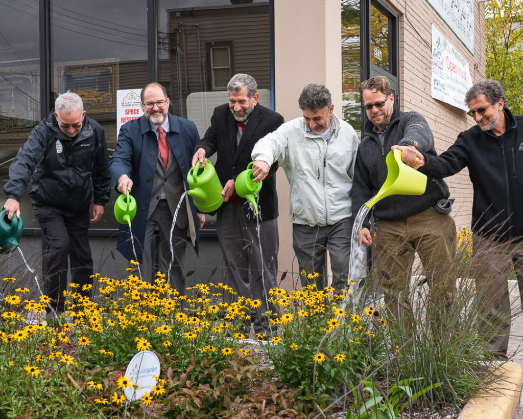 Project partners dedicate the rain gardens at the Islamic Cultural Community Center in October 2019.