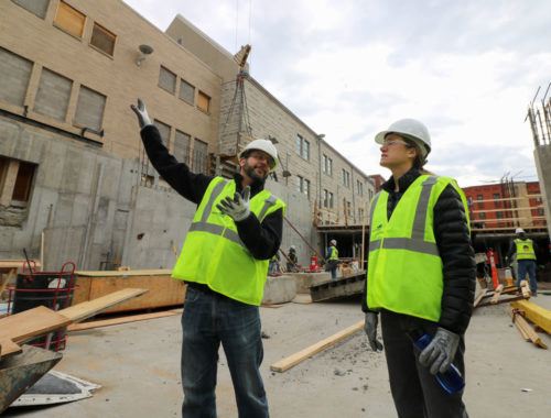 Rob Hunter, the project's lead architect, gives a tour of the construction site to MWMO Projects and Outreach Director Stephanie Johnson in February 2017.