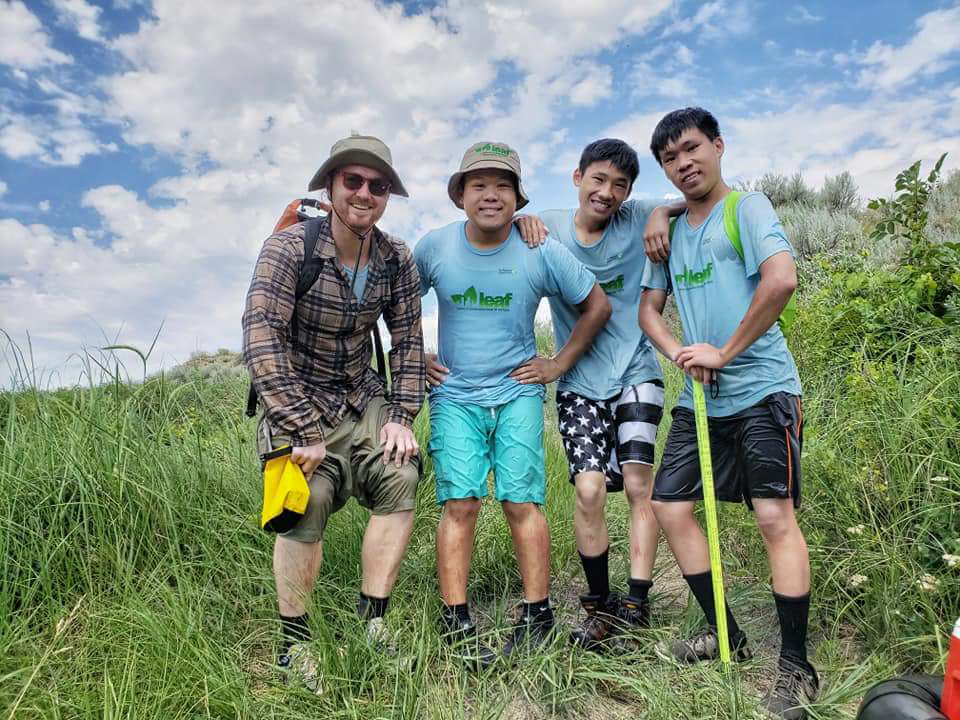 The LEAF interns and their mentor pose after swimming in a stream while doing plant monitoring. (Photo: The Nature Conservancy)