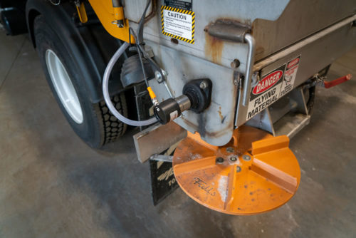 A salt spreader on the back of a City of Fridley snow plow truck.