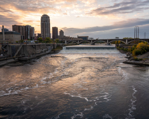 The Mississippi River and St. Anthony Falls at sunset.