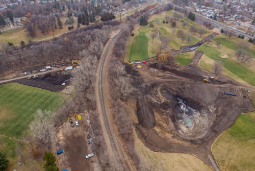 An aerial view of construction on the east side of the golf course (right) and at the rugby field (left).