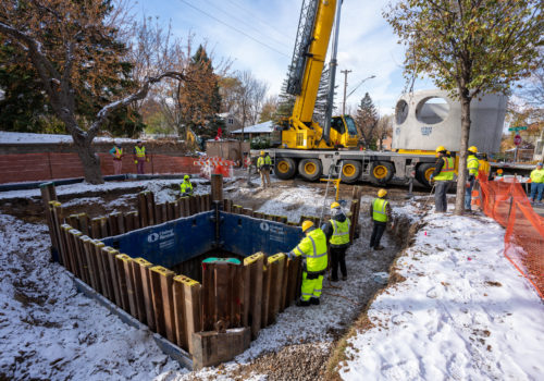 Workers installing a stormwater BMP in a Minneapolis street.