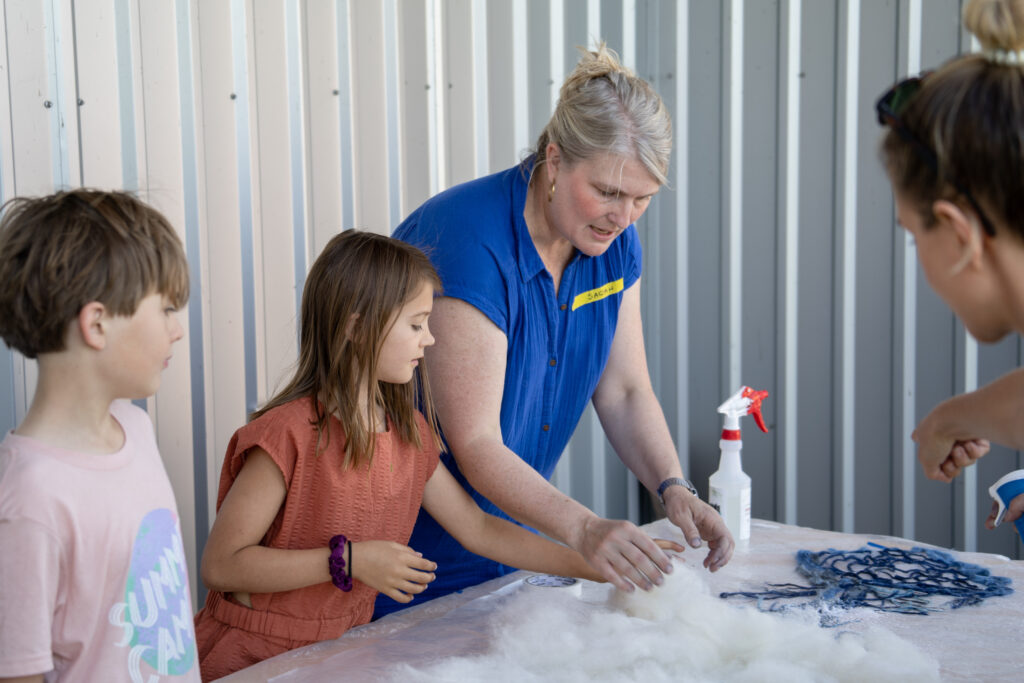 Sarah demonstrating felting at a workshop