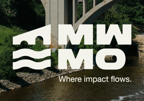 2026 MWMO Logo over an image of a boat on the Mississippi River