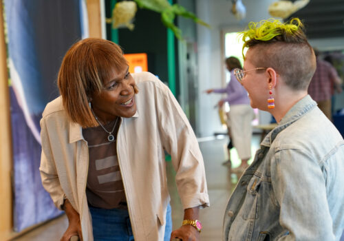 Andrea Jenkins speaking with community member after her poem reading
