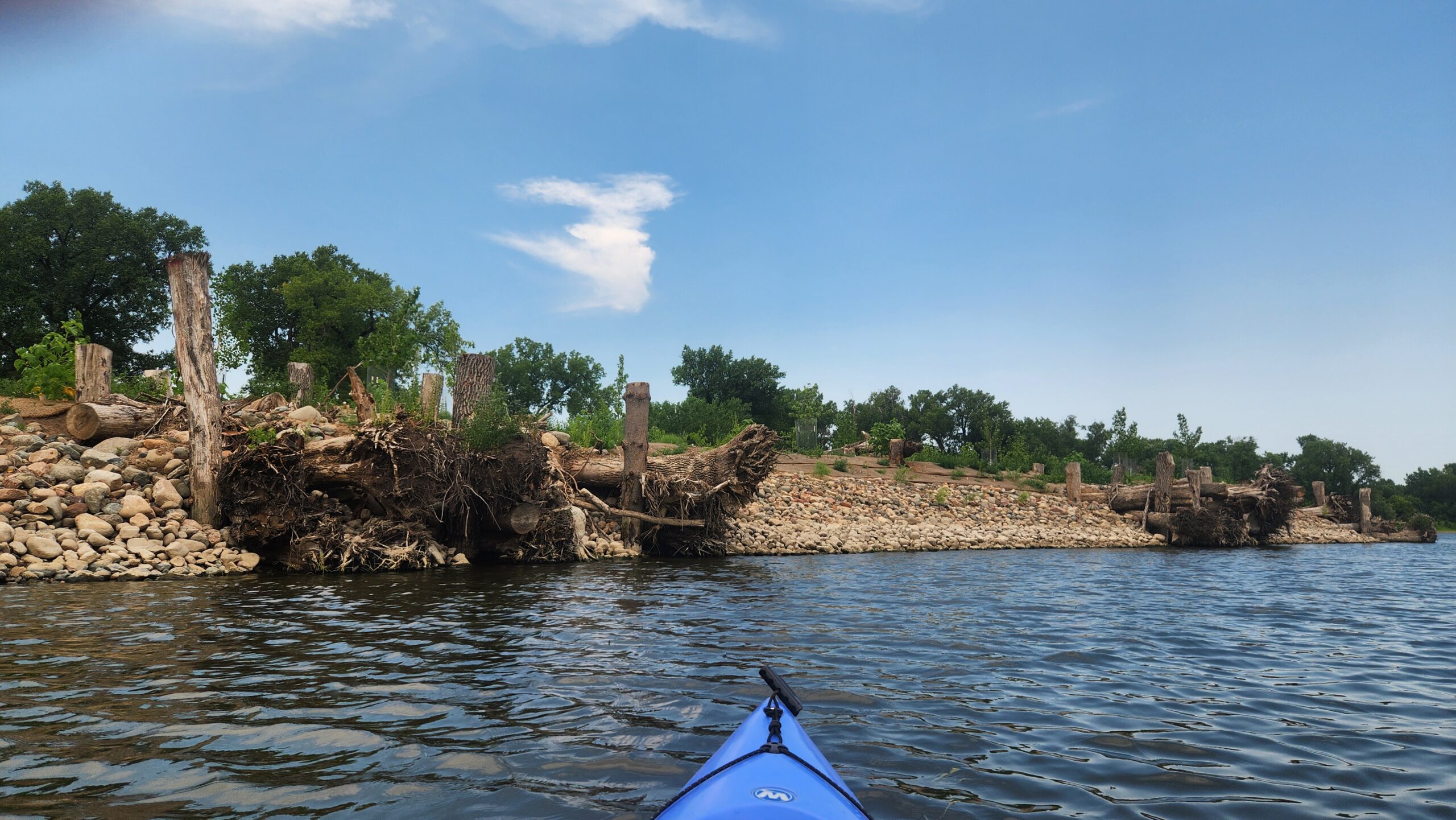 Restoration work in progress at Olson Island with a paddleboard visible in the bottom of the photo